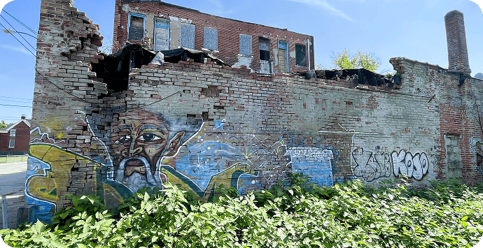 Community Alliances broken wall